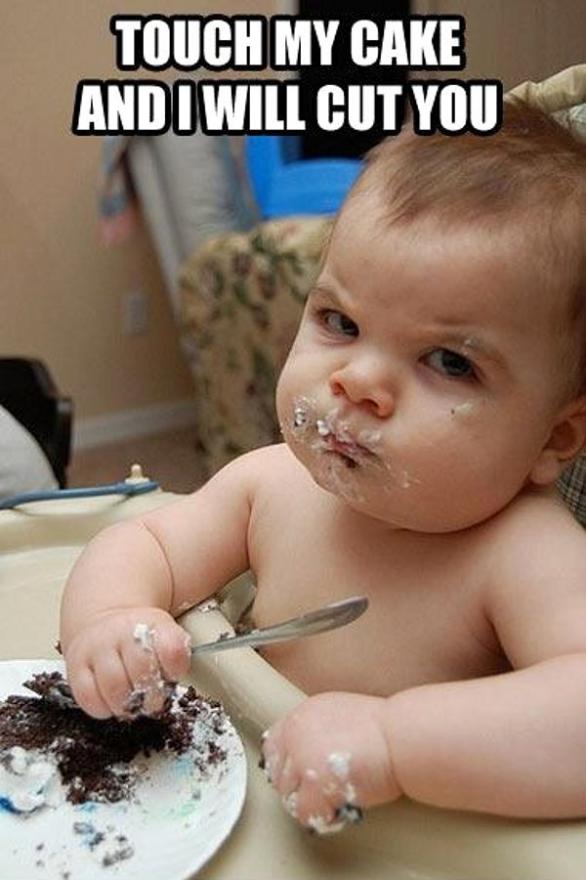 A Baby Eating Cake